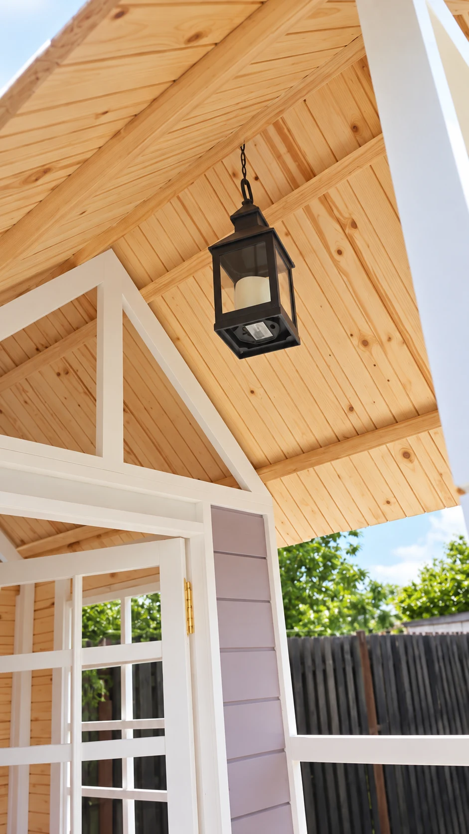 Timber-lined porch ceiling and hanging lantern at the Lilac Lookout